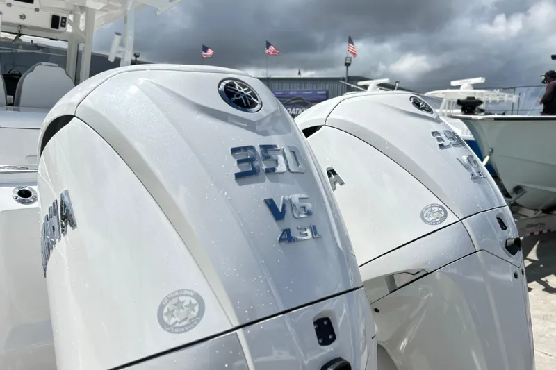 Slide: The Image of 2026 Sea Fox 328 Commander with Yamaha 350 V6 engines, under cloudy sky. - 45