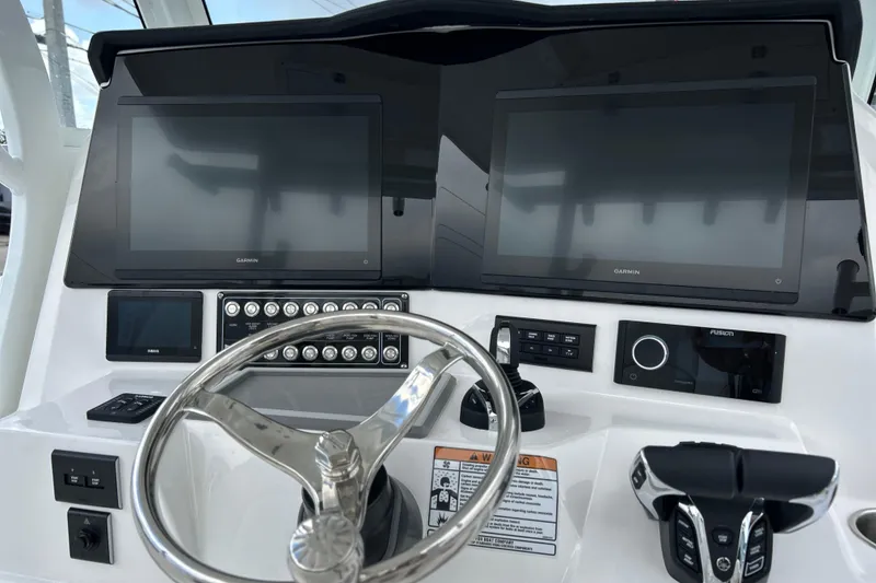 Slide: The Image of 2026 Sea Fox 328 Commander helm with dual Garmin displays and modern controls. - 5