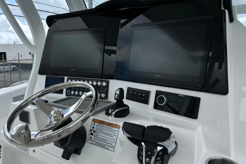 Slide: The Image of 2026 Sea Fox 328 Commander helm with dual Garmin displays and advanced controls. - 6