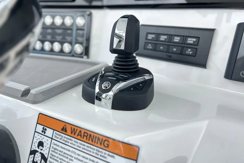 Slide: The Image of Control panel of 2026 Sea Fox 328 Commander boat with joystick and warning label. - 7