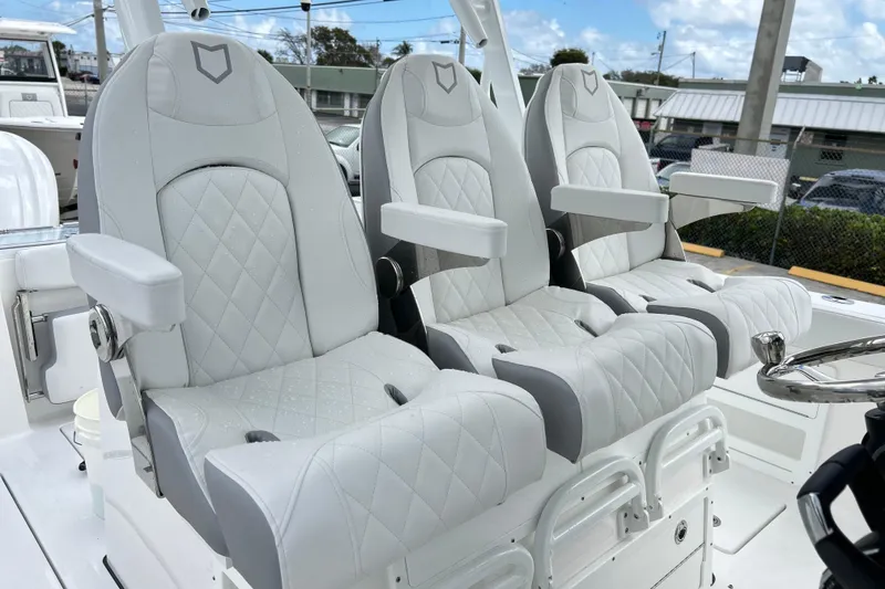 Slide: The Image of Luxurious seating on 2026 Sea Fox 328 Commander boat, featuring elegant white upholstery. - 8