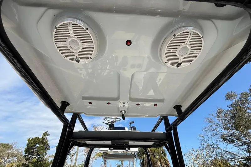 Slide: The Image of 2024 Xplor X24 boat speakers on T-top, clear sky background. - 20