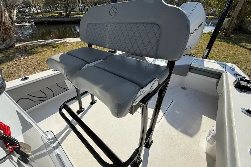 Slide: The Image of Gray seating on 2024 Xplor X24 boat, featuring diamond-patterned upholstery and sturdy black frame. - 25