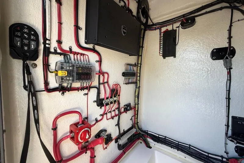 Slide: The Image of 2024 Xplor X24 electrical system with organized wiring and control panel. - 27