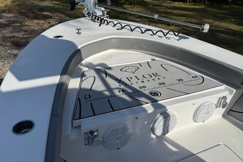 Slide: The Image of 2024 Xplor X24 boat deck with speakers and measurement markings. - 36