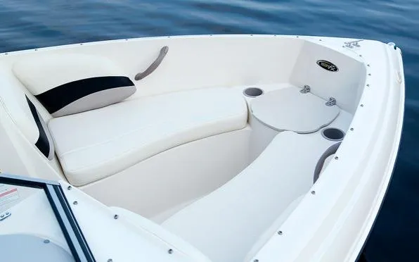 Slide: The Image of Manufacturer Provided Image: 2015 Stingray 191 RX boat interior with white seating and cup holders. - 10