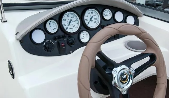 Slide: The Image of Manufacturer Provided Image: 2015 Stingray 191 RX boat dashboard with gauges and steering wheel. - 11
