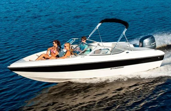 Slide: The Image of Manufacturer Provided Image: 2015 Stingray 191 RX boat cruising on the water with passengers. - 8