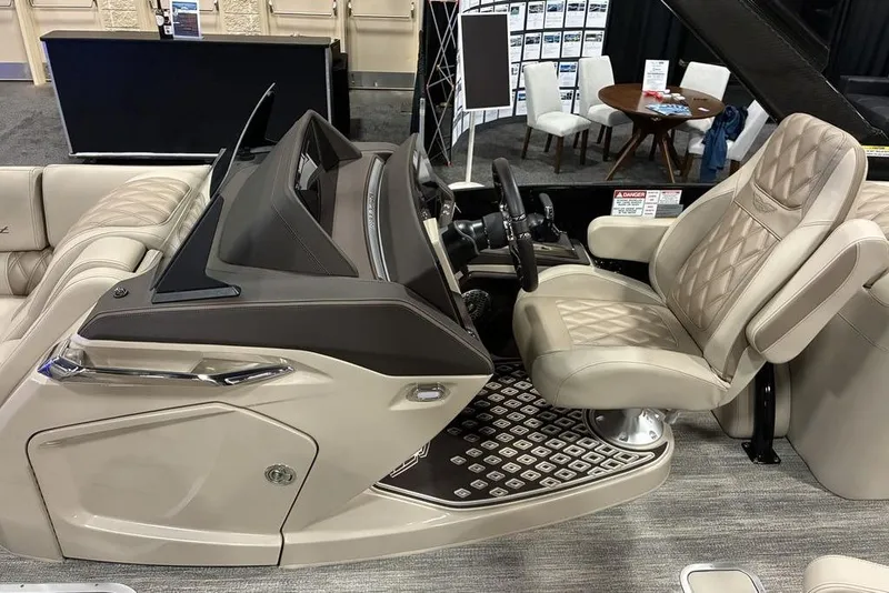 Slide: The Image of Luxurious interior of 2026 Bennington 25 RXFBA boat with plush seating and modern dashboard. - 3