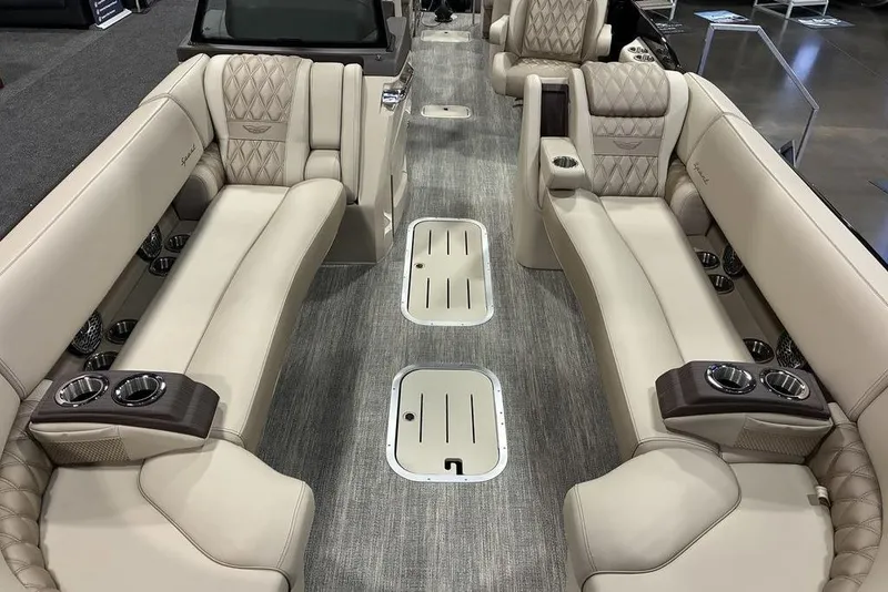 Slide: The Image of Luxurious interior of 2026 Bennington 25 RXFBA boat with plush seating and cup holders. - 5