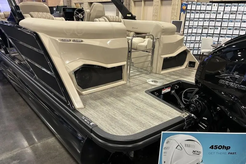 Slide: The Image of 2026 Bennington 25 RXFBA boat with Yamaha 450hp XTO engine displayed indoors. - 9