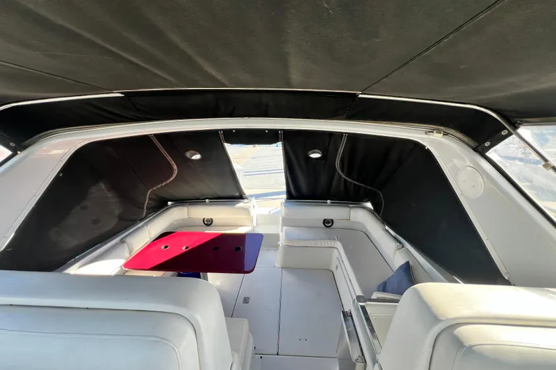 Slide: The Image of Interior of 1987 Chris-Craft 412 Amerosport boat with seating and red table. - 10