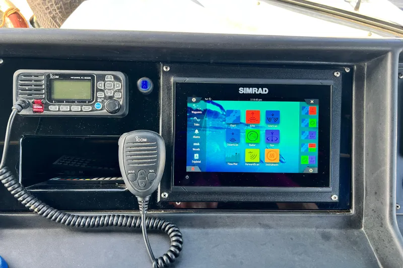 Slide: The Image of Control panel of a 1987 Chris-Craft 412 Amerosport with Simrad and Icom devices. - 15