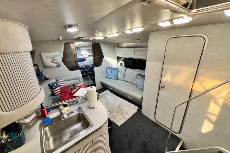 Slide: The Image of Interior of 1987 Chris-Craft 412 Amerosport yacht with cozy seating and modern amenities. - 21