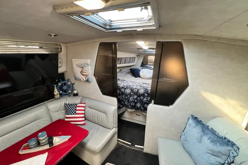 Slide: The Image of Interior of 1987 Chris-Craft 412 Amerosport yacht with cozy seating and nautical decor. - 31