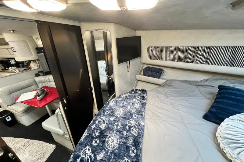 Slide: The Image of Interior of 1987 Chris-Craft 412 Amerosport yacht with cozy bedroom and seating area. - 34