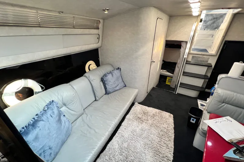 Slide: The Image of Interior of 1987 Chris-Craft 412 Amerosport yacht with sofa, stairs, and modern decor. - 36