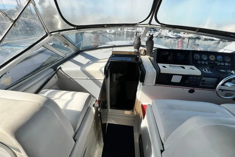 Slide: The Image of 1987 Chris-Craft 412 Amerosport boat interior with helm and seating area. - 9