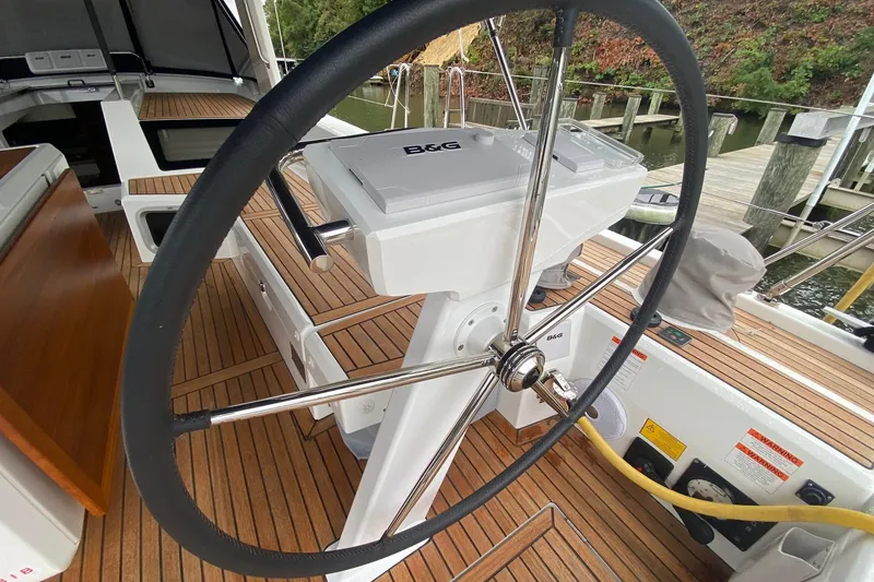 Slide: The Image of Steering wheel of 2019 Beneteau Oceanis 51.1 yacht with teak deck and B&G navigation. - 18