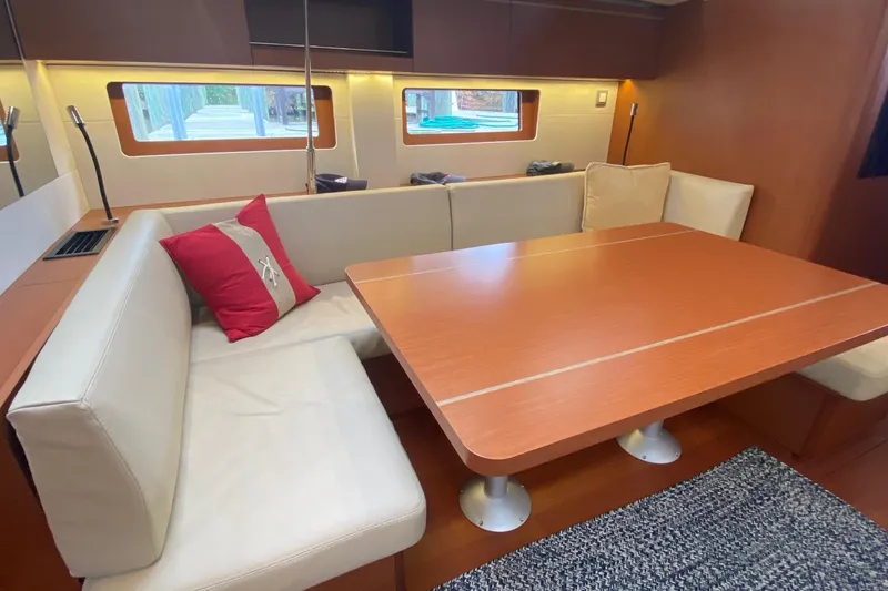 Slide: The Image of Interior of 2019 Beneteau Oceanis 51.1 yacht with cozy dining area and modern design. - 29