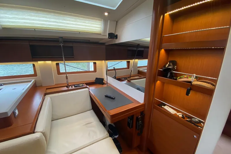 Slide: The Image of Luxurious interior of 2019 Beneteau Oceanis 51.1 yacht with modern furnishings and ample storage. - 3