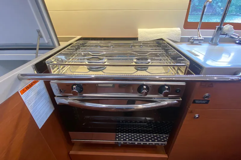 Slide: The Image of Galley kitchen in 2019 Beneteau Oceanis 51.1 yacht with stove and sink. - 34