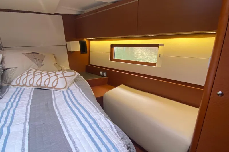 Slide: The Image of Luxurious cabin interior of 2019 Beneteau Oceanis 51.1 yacht with cozy bedding. - 38