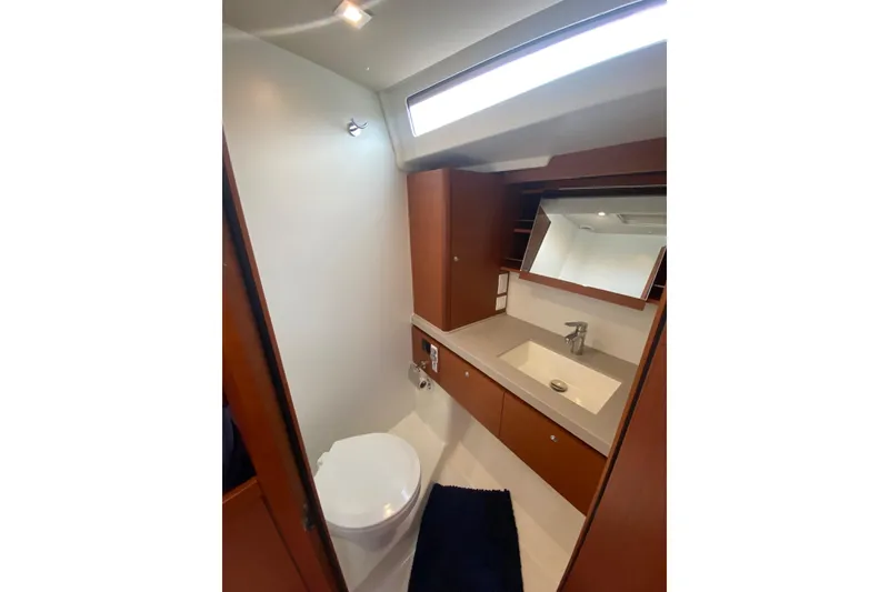 Slide: The Image of Luxurious bathroom in 2019 Beneteau Oceanis 51.1 yacht with modern fixtures and wood accents. - 39