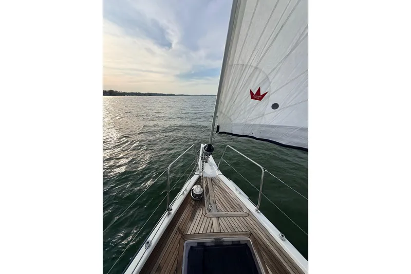 Slide: The Image of Sailing on a 2019 Beneteau Oceanis 51.1 yacht, open waters, clear sky. - 4