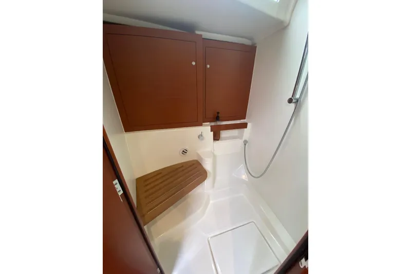 Slide: The Image of 2019 Beneteau Oceanis 51.1 yacht bathroom with wooden cabinetry and shower. - 40