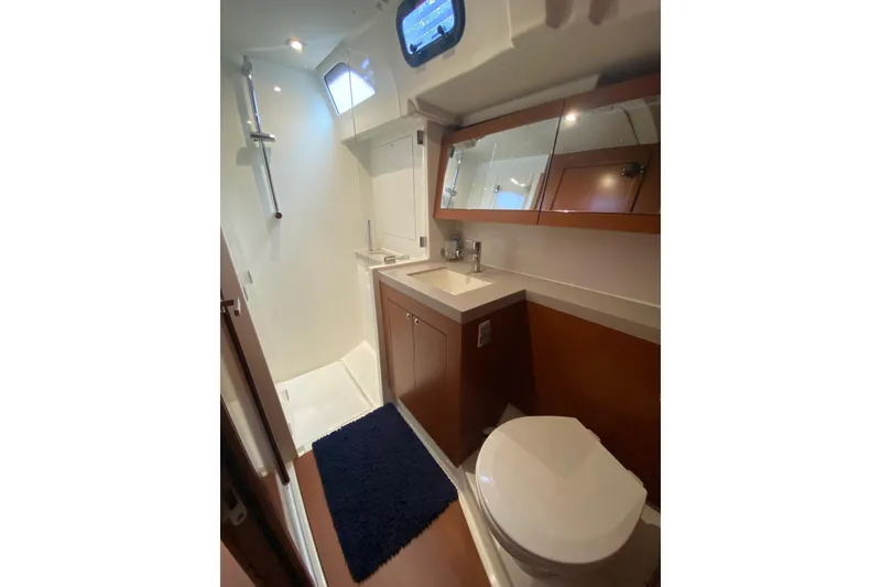 Slide: The Image of Bathroom interior of 2019 Beneteau Oceanis 51.1 yacht, featuring shower, sink, and toilet. - 42