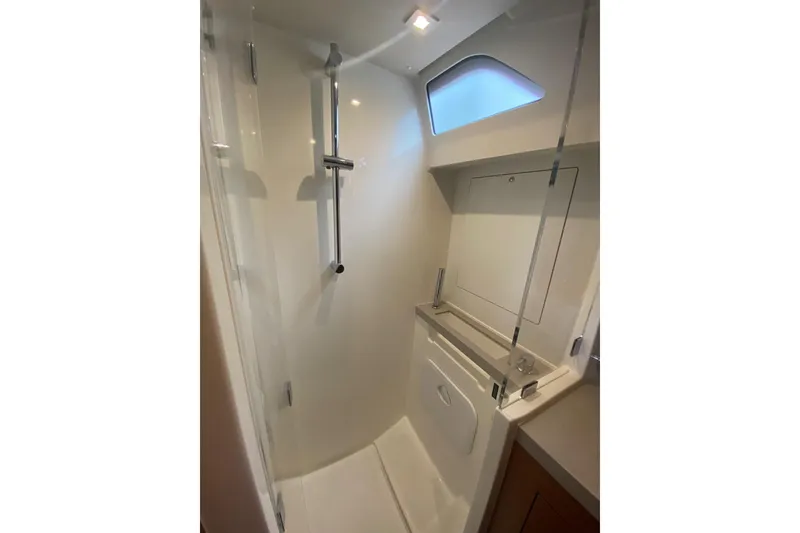 Slide: The Image of Shower area in 2019 Beneteau Oceanis 51.1 yacht, featuring modern fixtures and natural light. - 43