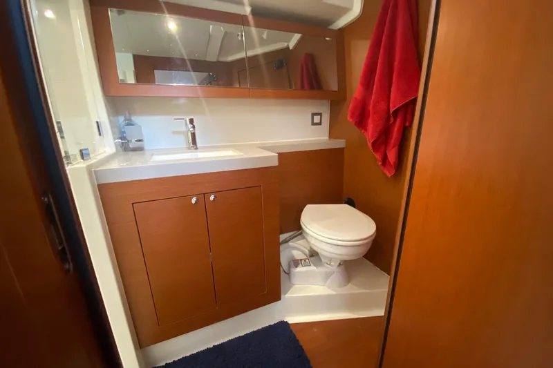 Slide: The Image of Bathroom interior of 2019 Beneteau Oceanis 51.1 yacht with wooden cabinetry and modern fixtures. - 44