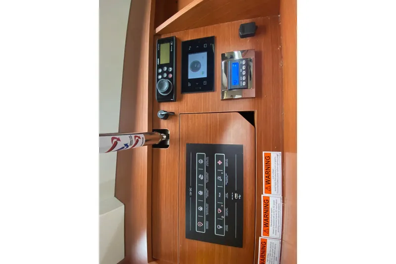 Slide: The Image of Control panel of 2019 Beneteau Oceanis 51.1 yacht with navigation and warning labels. - 45