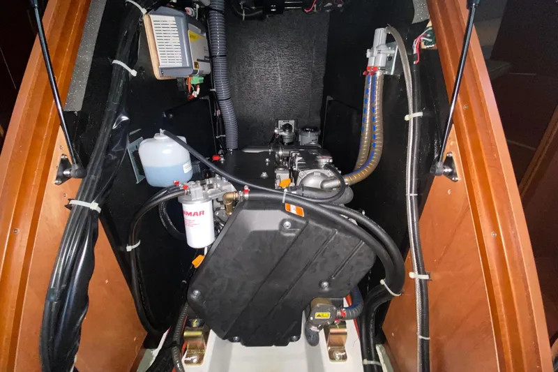 Slide: The Image of Engine compartment of 2019 Beneteau Oceanis 51.1 sailboat, showcasing mechanical components. - 47