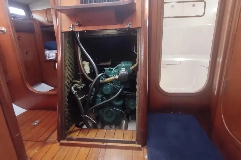 Slide: The Image of Engine compartment of a 1990 Beneteau Oceanis 390 sailboat, showcasing interior details. - 26