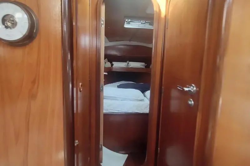 Slide: The Image of Interior cabin of 1990 Beneteau Oceanis 390 sailboat with wooden finish. - 28