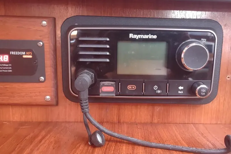 Slide: The Image of Raymarine marine radio on 1990 Beneteau Oceanis 390 yacht dashboard. - 35