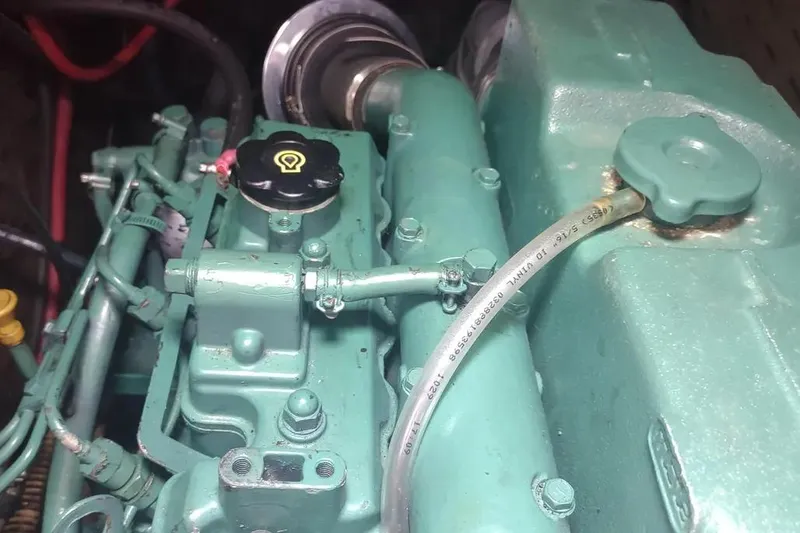 Slide: The Image of Engine of a 1990 Beneteau Oceanis 390 sailboat, showcasing mechanical components. - 43