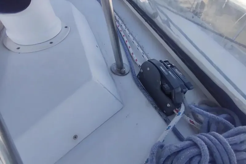 Slide: The Image of Deck view of a 1990 Beneteau Oceanis 390 sailboat, featuring rigging and cleat. - 46