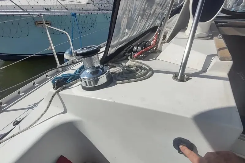 Slide: The Image of Beneteau Oceanis 390 sailboat deck with winch and ropes, 1990 model. - 5