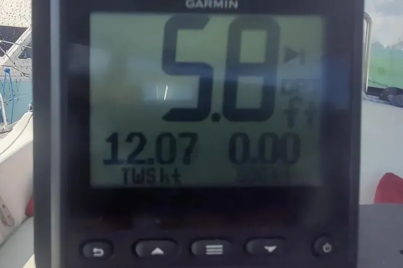 Slide: The Image of Garmin display on 1990 Beneteau Oceanis 390 showing speed and wind data. - 52