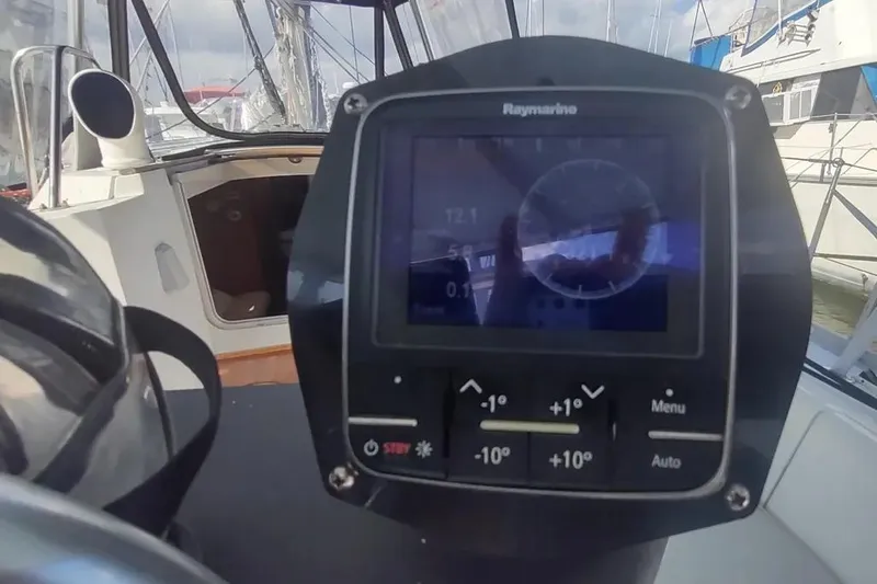 Slide: The Image of Raymarine navigation display on 1990 Beneteau Oceanis 390 sailboat cockpit. - 53