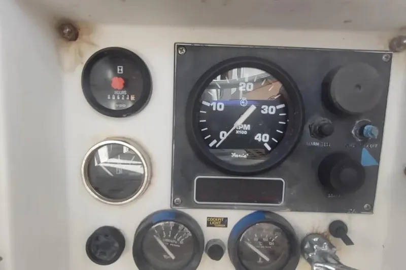 Slide: The Image of Control panel of a 1990 Beneteau Oceanis 390 sailboat, featuring gauges and dials. - 55