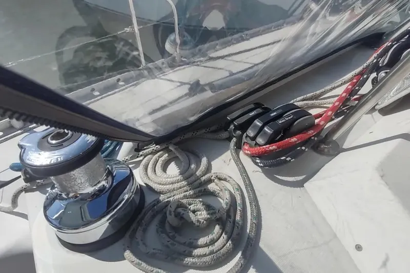 Slide: The Image of Deck of 1990 Beneteau Oceanis 390 sailboat with winch and ropes. - 6