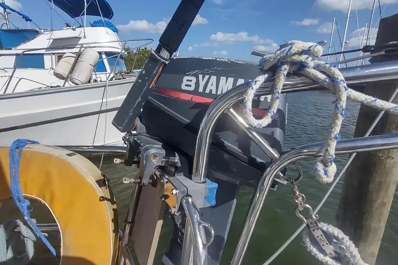 Slide: The Image of Beneteau Oceanis 390 sailboat with Yamaha outboard motor at marina, 1990 model. - 9