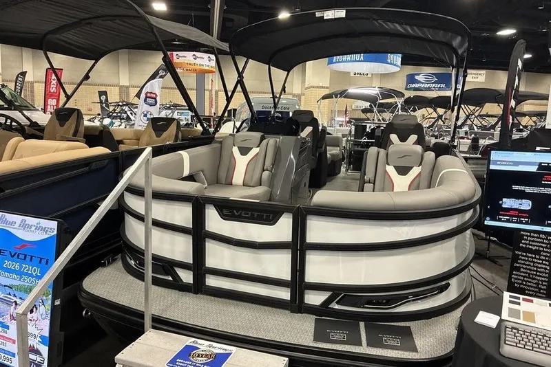 The Image of 2026 Evotti 721QL luxury pontoon boat displayed at a boat show. - 1