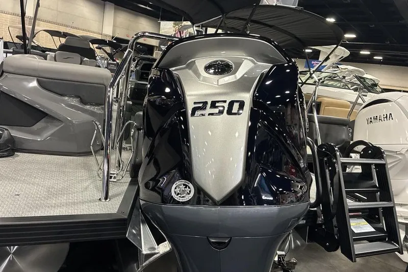 Slide: The Image of Evotti 721QL 2026 boat with 250 horsepower engine displayed indoors. - 10