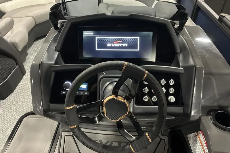Slide: The Image of 2026 Evotti 721QL boat dashboard with steering wheel and digital display. - 6