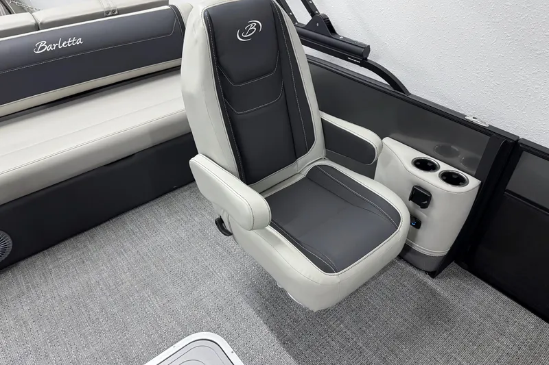 Slide: The Image of 2026 Barletta Cabrio 24UC boat interior with luxurious seating and cup holders. - 18